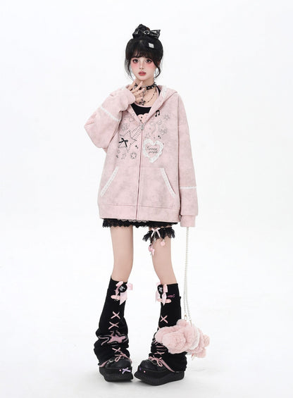 Person wearing a pink hoodie with decorative elements on a white background