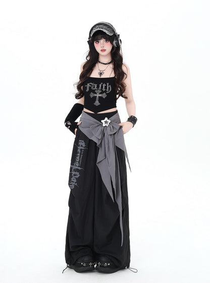 Person wearing a black and gray outfit with 'Faith' text on a white background