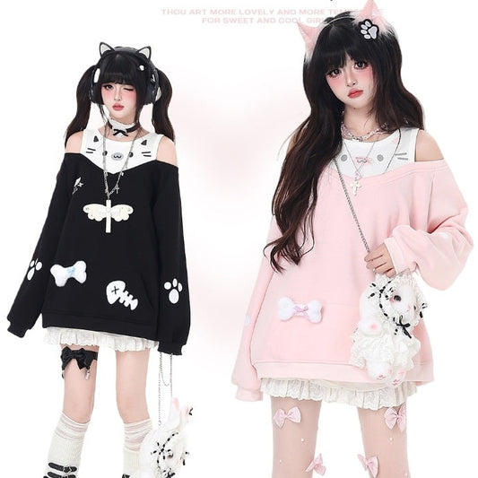Two individuals wearing cat-themed outfits.