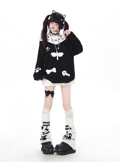 Person wearing a black and white outfit with cat-themed design on a white background