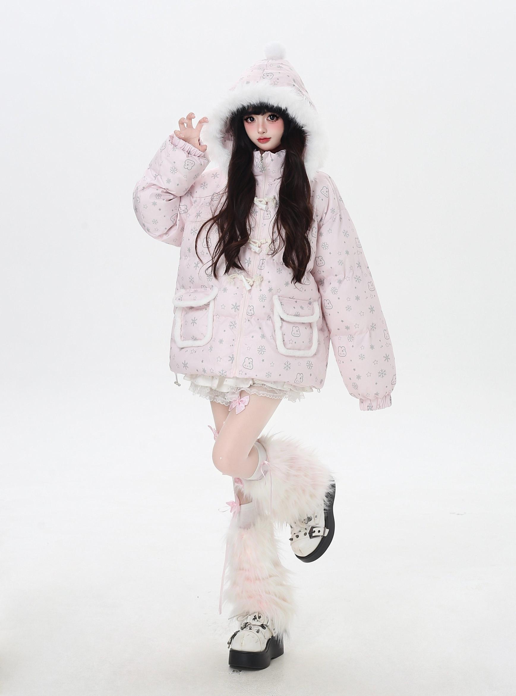 Person wearing a pink floral coat and white boots on a white background