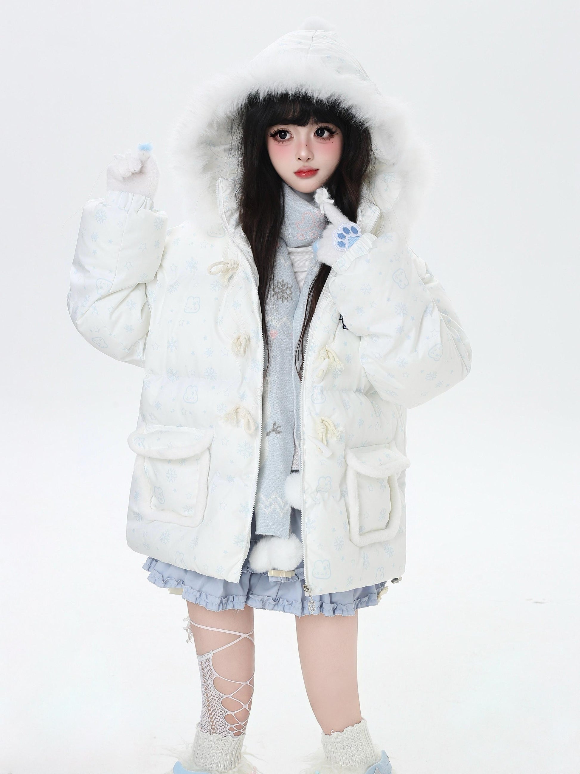 Person wearing a white fluffy coat with a hood on a white background