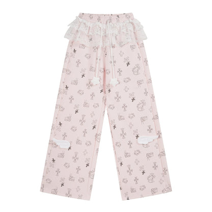 Pink pajama pants with cartoon character print on a white background