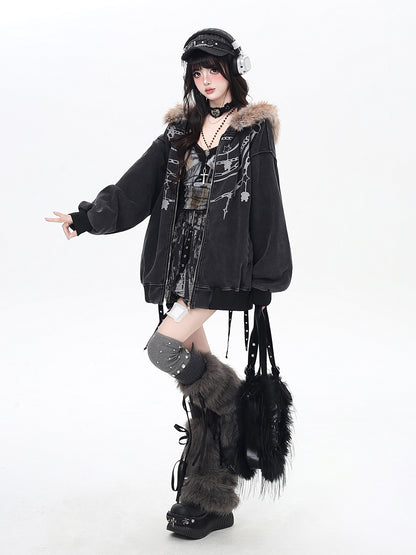 Person wearing a dark coat with fur trim and high boots on a white background