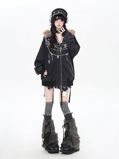 Person wearing a black outfit with fur details on a white background