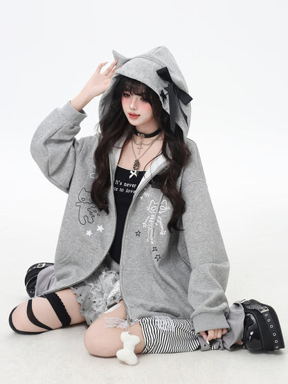 Person wearing a gray hoodie with animal ears on a white background