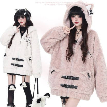 Two women wearing fluffy hoodies with cat ears, one white and one pink.