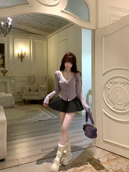 Woman standing in a stylishly decorated room with a mirror reflecting her.