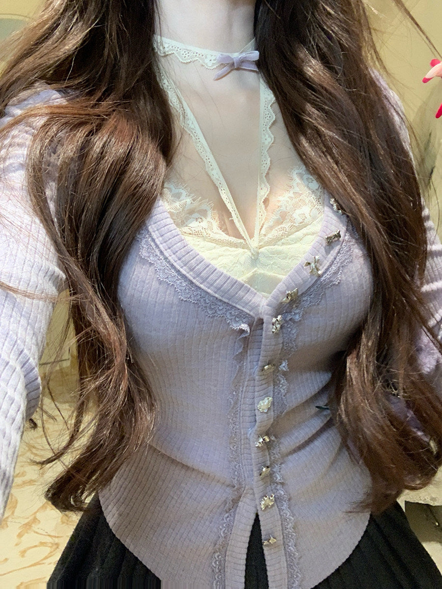 Mannequin wearing a light purple cardigan over a sheer top with lace details.