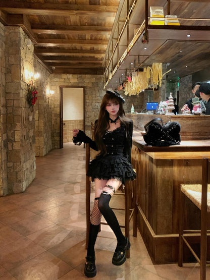 Person in a black outfit standing in a restaurant interior with wooden decor.