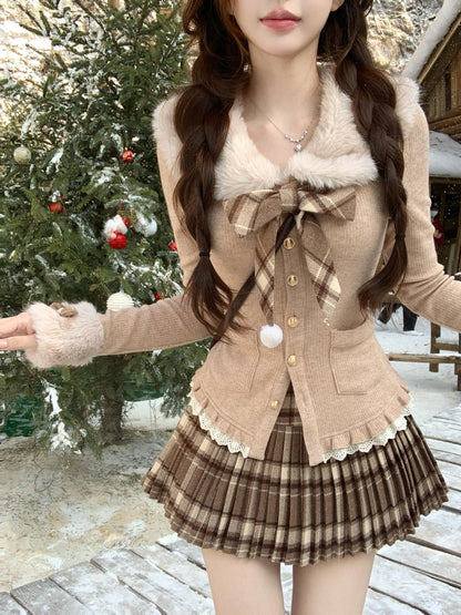Person wearing a stylish coquette winter brown outfit with a plaid skirt and fur-trimmed jacket in a snowy outdoor setting.