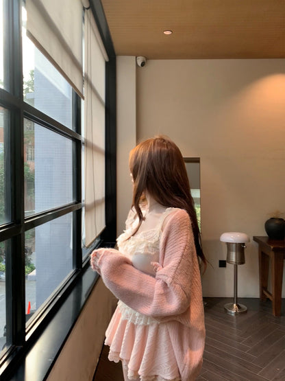 Woman standing by a large window in a modern interior setting