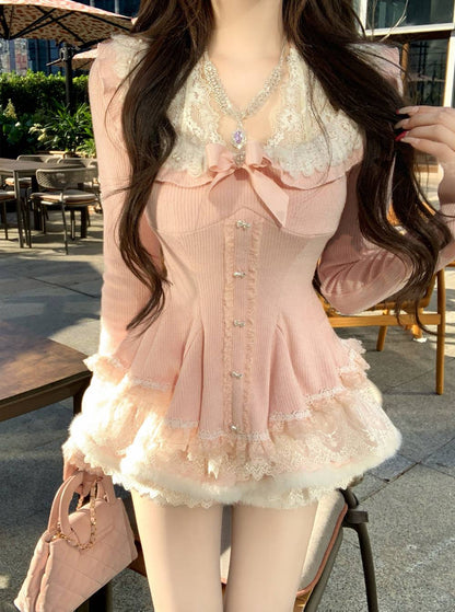 Person wearing a pink dress with lace details outdoors.