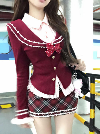 Person wearing a red and white school uniform with a plaid skirt, standing in an indoor setting.