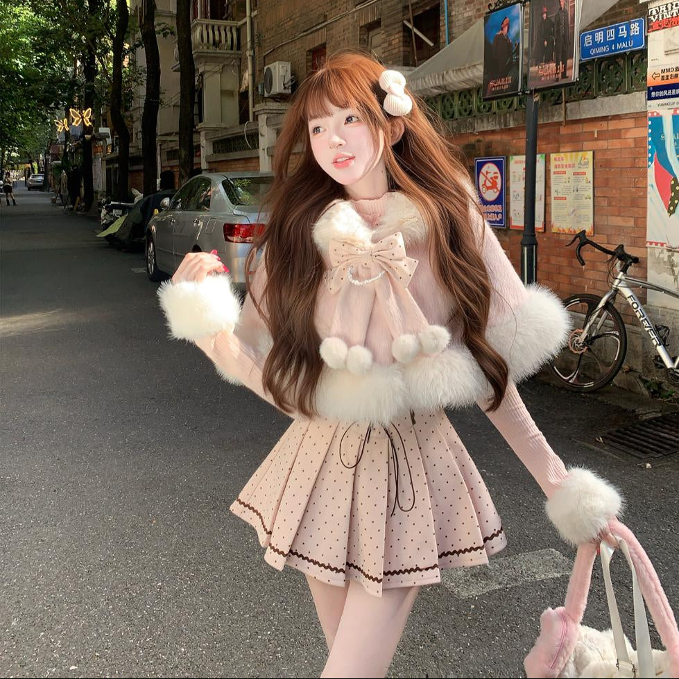 Person in a pink dress with white fur trim standing on a city street.