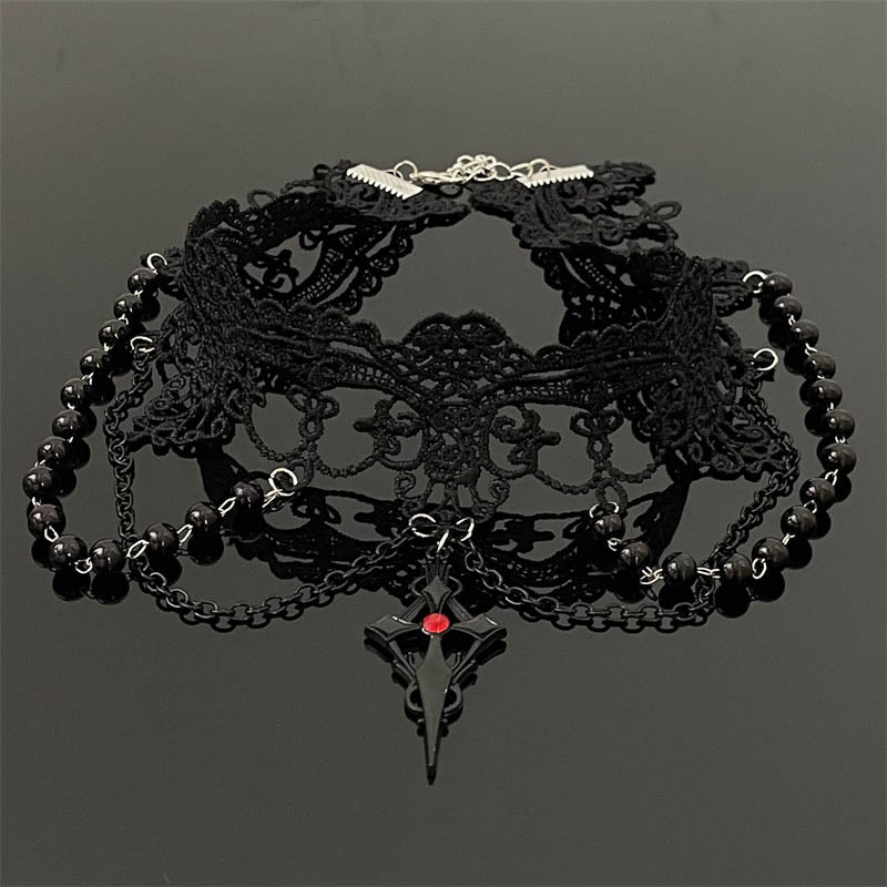 Black lace choker with beads on a dark background
