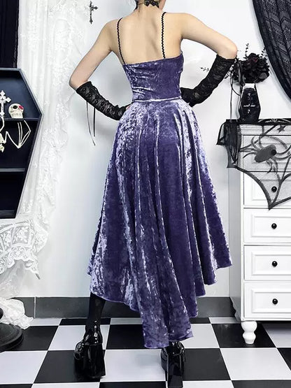Person wearing a purple velvet dress in a room with black and white checkered floor.