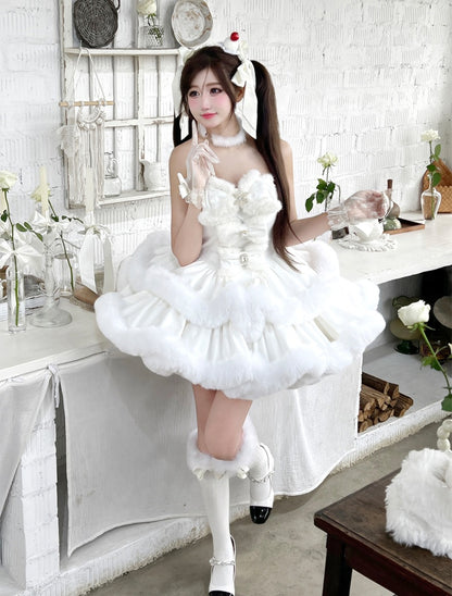 Person in a white dress with ruffles and a headband in a room with white walls and decor.