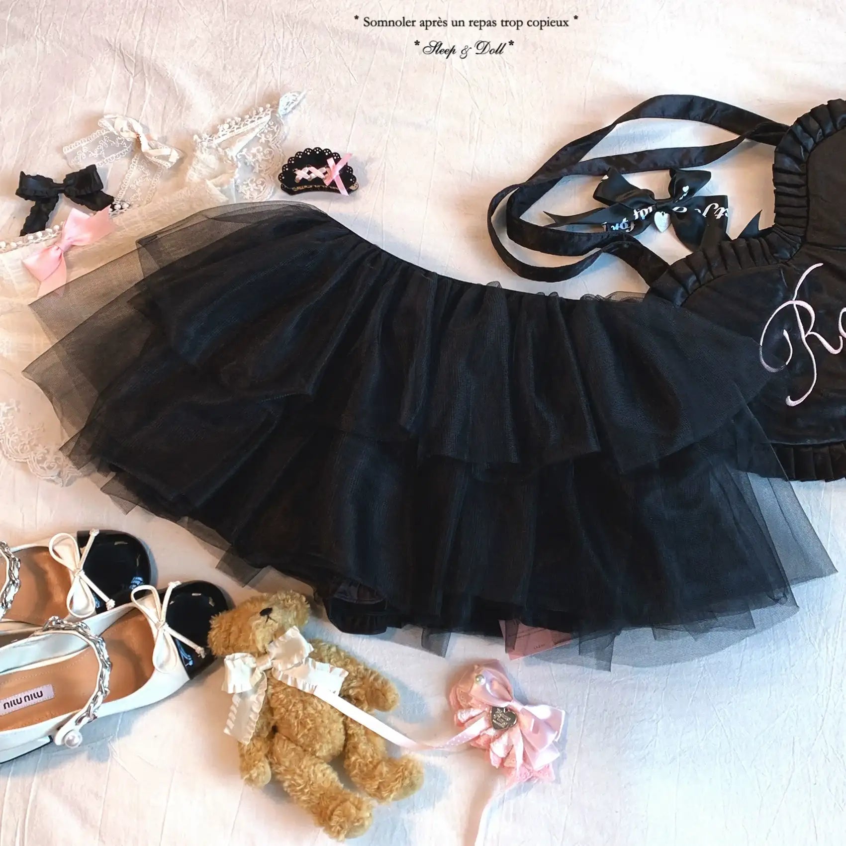 Black tutu skirt with accessories on a light background