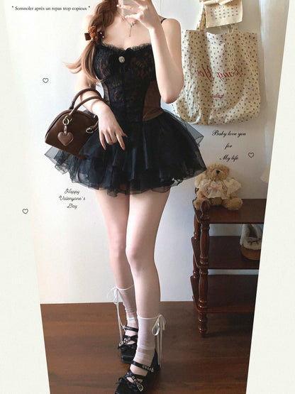 Person wearing a black lace dress with a white background