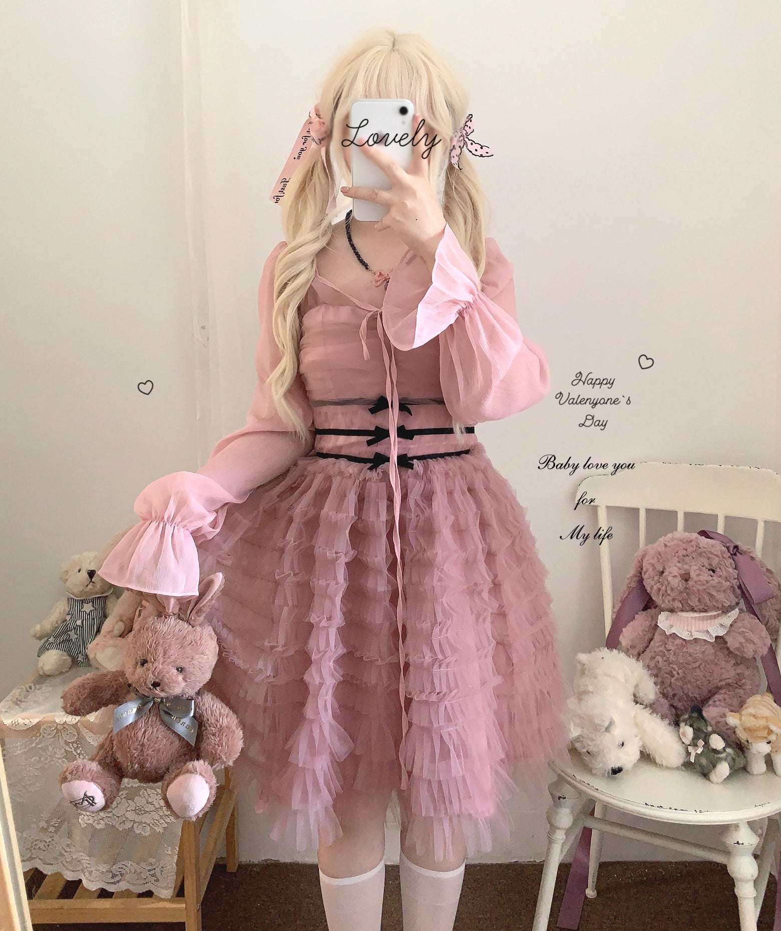 Person wearing a pink dress with teddy bears around