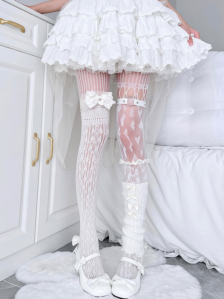 Person wearing a white ruffled skirt, white knee-high socks with lace details, and white shoes in a room.