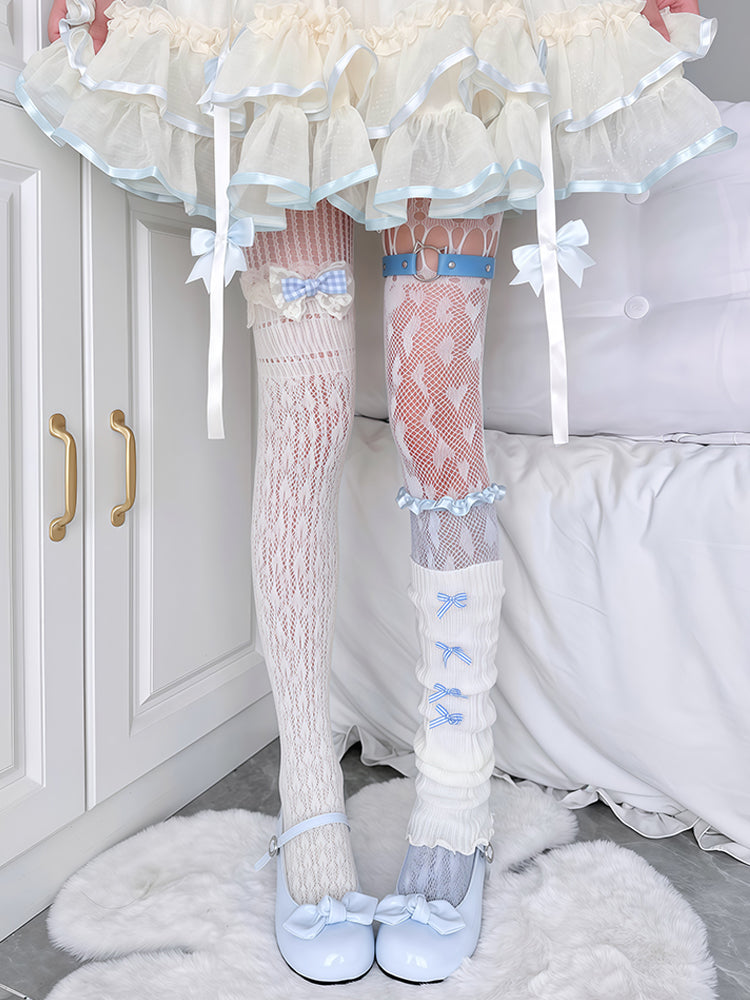 Leggings with lace details and bow accents worn by a person in a bedroom setting.