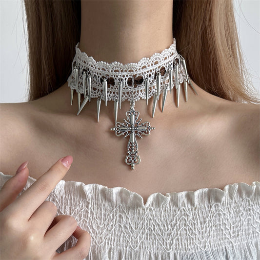 Person wearing a decorative choker necklace with spikes and a cross pendant.