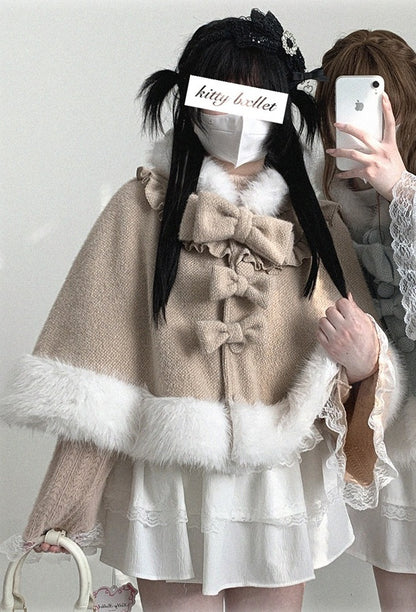 Person wearing a beige bow-detailed coat with white fur trim against a plain background