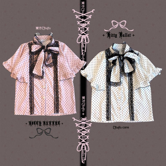 Two polka dot shirts with lace details on a gray background