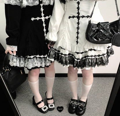 white skirt and black skirt with large cross pattern sewn with laces and lace ruffle hem