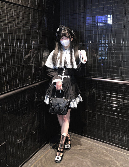 a woman wearing a white blouse and black high-waisted skirt with lace cross detailing and ruffle trim