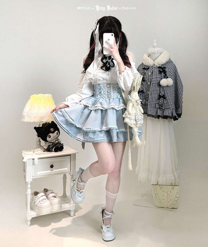 Person wearing a pastel outfit with a skirt and top, standing in a room with a lamp and clothing items.