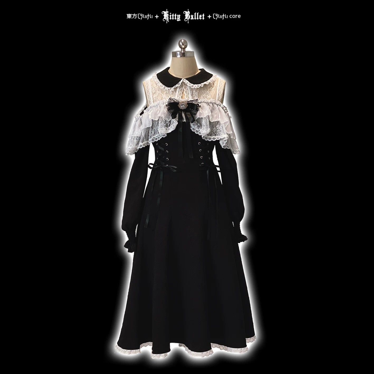 Black dress with white lace details on a mannequin against a black background