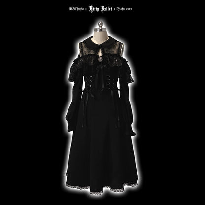 Black gothic-style dress on a mannequin against a black background