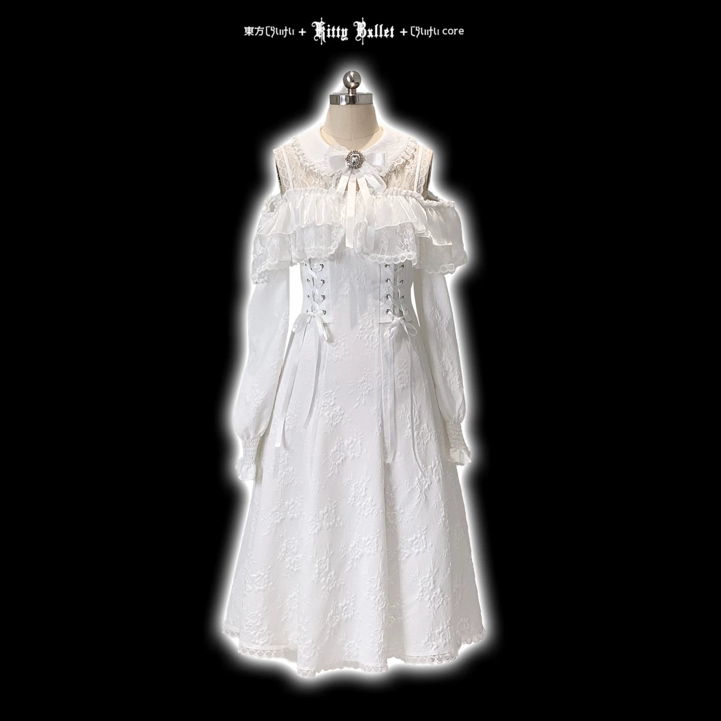 White lace dress on a mannequin against a black background