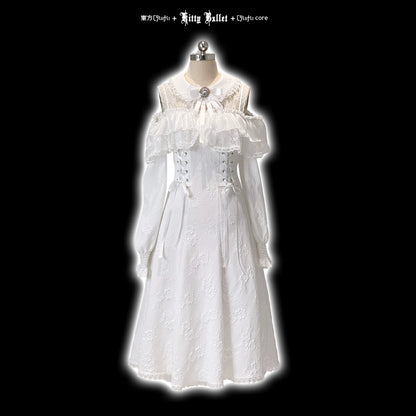 White lace dress on a mannequin against a black background