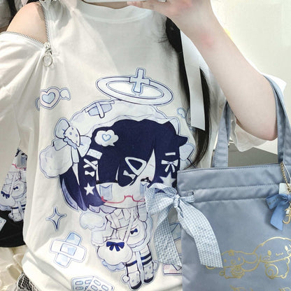 Person wearing a white t-shirt with cartoon character design and holding a blue handbag.