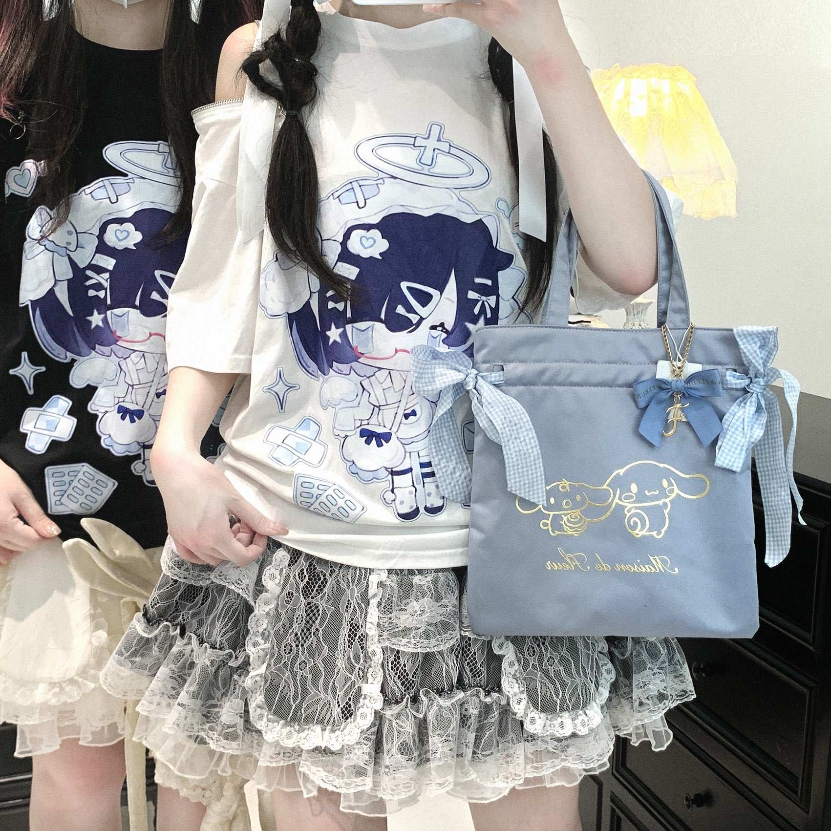a person wearing white loose-fit t-shirt with off-shoulder zipper and angel girl print