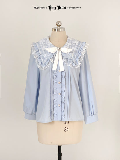 Light blue blouse with lace collar on a mannequin against a plain background