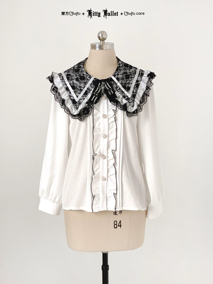 White blouse with black lace collar on a mannequin against a white background