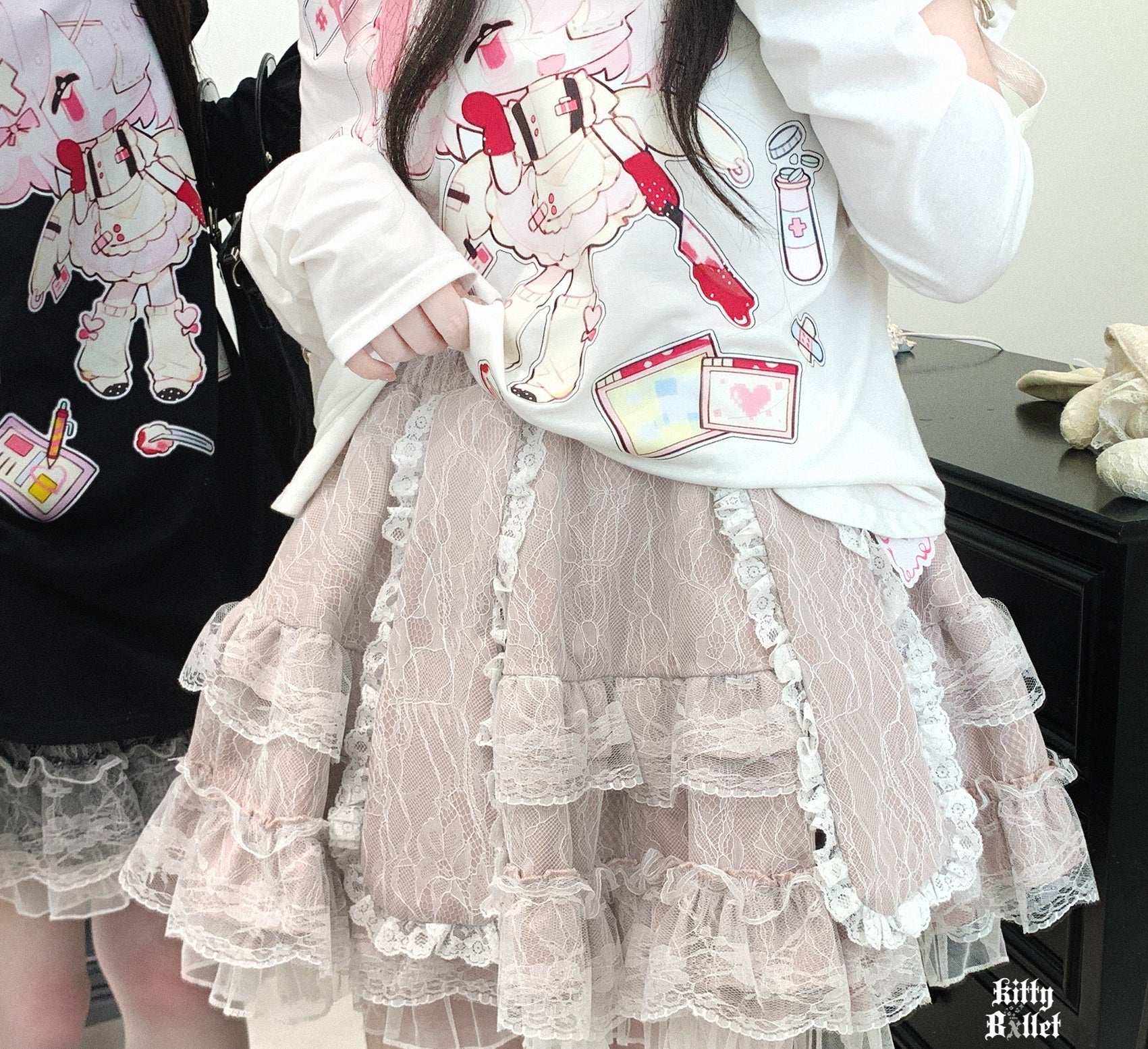 close-up of multi-layered lace skirt with cute rabbit ears