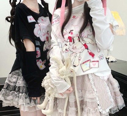 Two people wearing outfits with cartoon character designs and ruffled skirts.