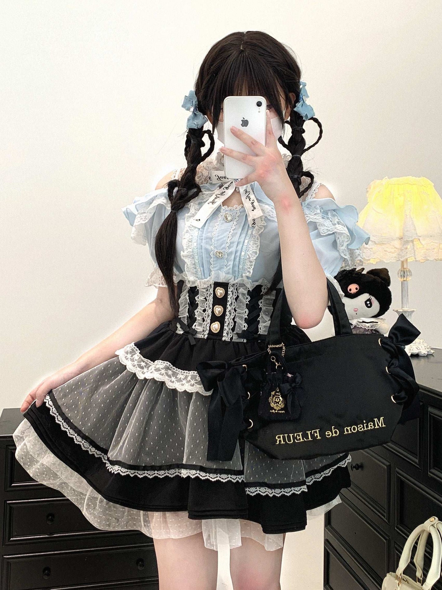 blue off-shoulder blouse with lace stitching and feminine appeal