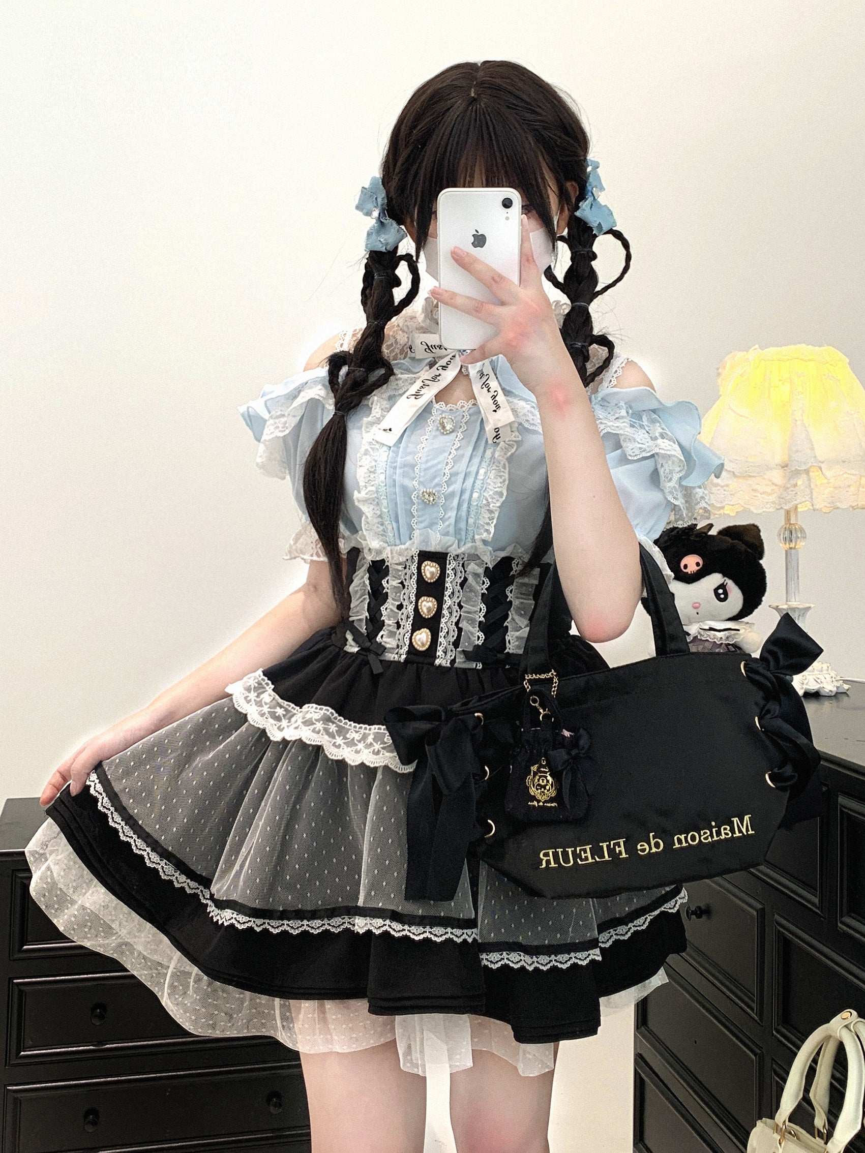 blue off-shoulder blouse with lace stitching and feminine appeal