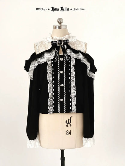 Black blouse with white lace details in jirai kei style on a mannequin against a white background