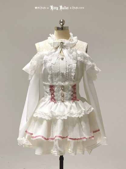 White lace jirai kei dress with red trim on a mannequin against a gray background