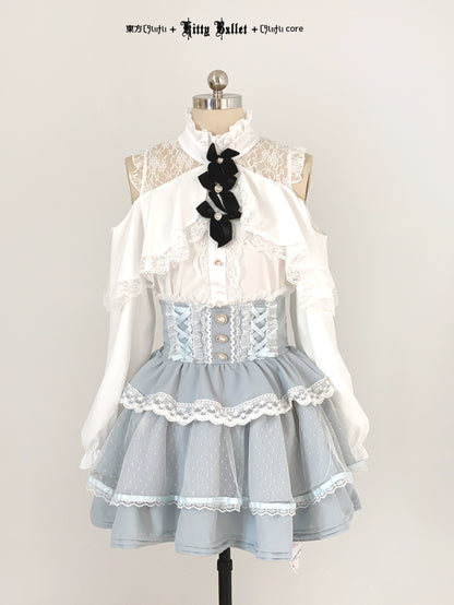 Lolita jirai kei fashion dress on a mannequin with white blouse and blue skirt.