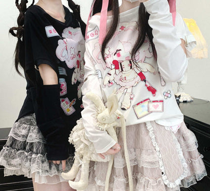 Two people wearing outfits with cartoon character designs and ruffled skirts.
