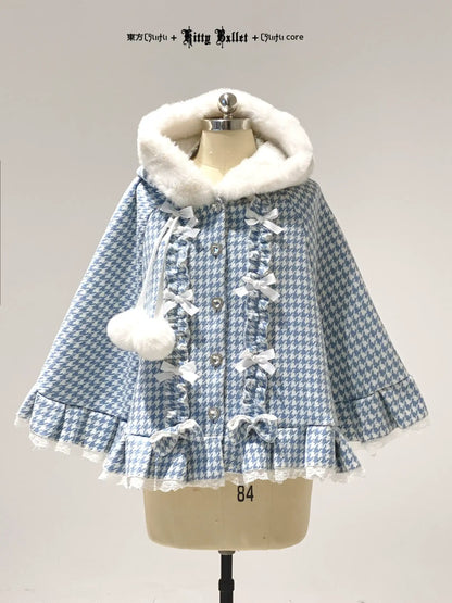 Blue and white checkered coat with white fur hood on a mannequin against a gray background